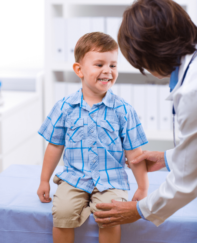 Young boy getting a health exam by a pediatric provider in Rapid City
