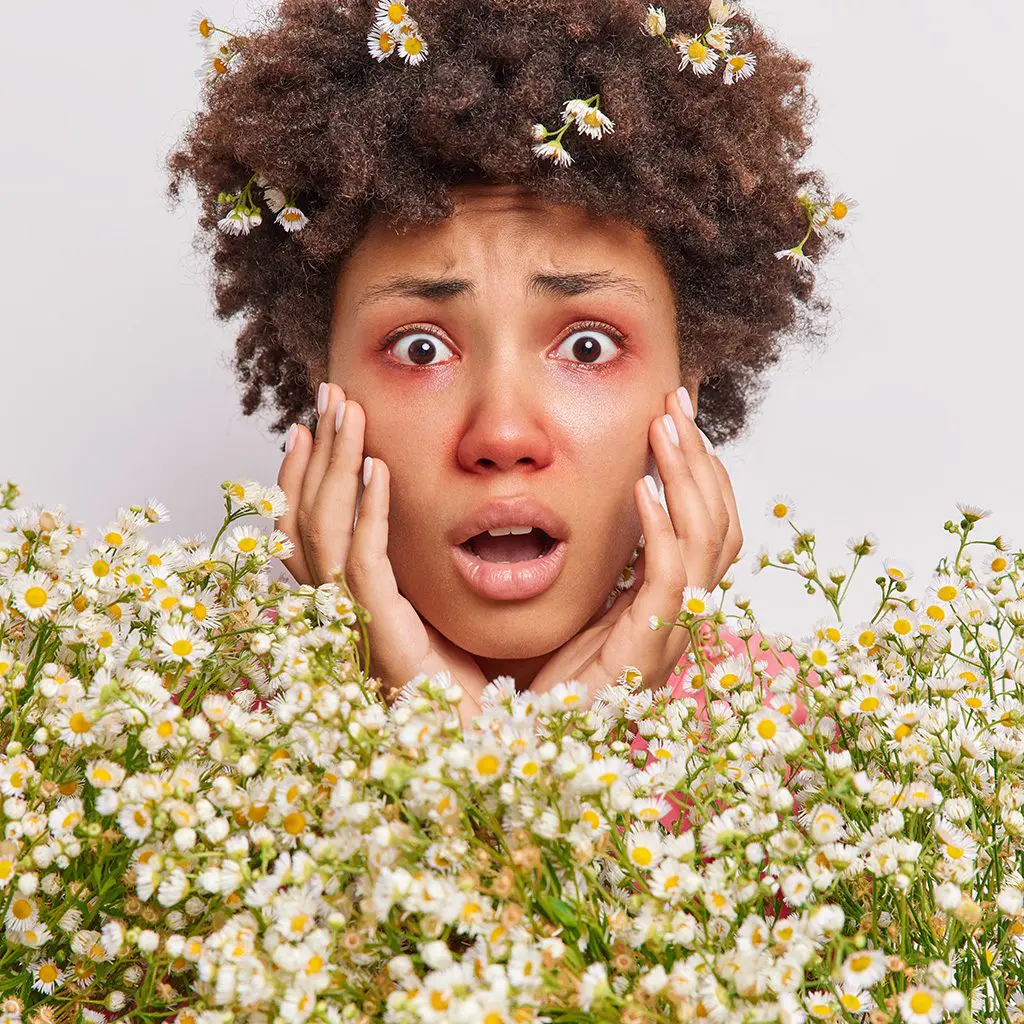 Close up shot of worried woman suffering from allergies