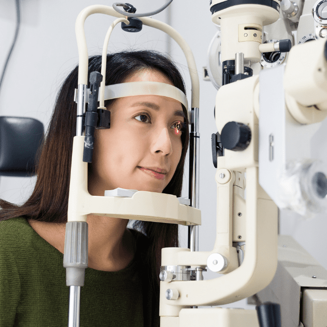 Woman being seen by an Ophthalmology provider in Rapid City getting her eyes checked