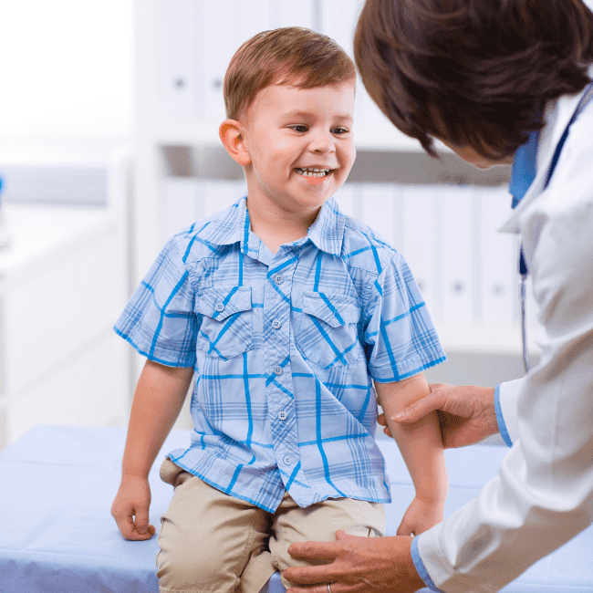 Young boy getting a health exam by a pediatric provider in Rapid City
